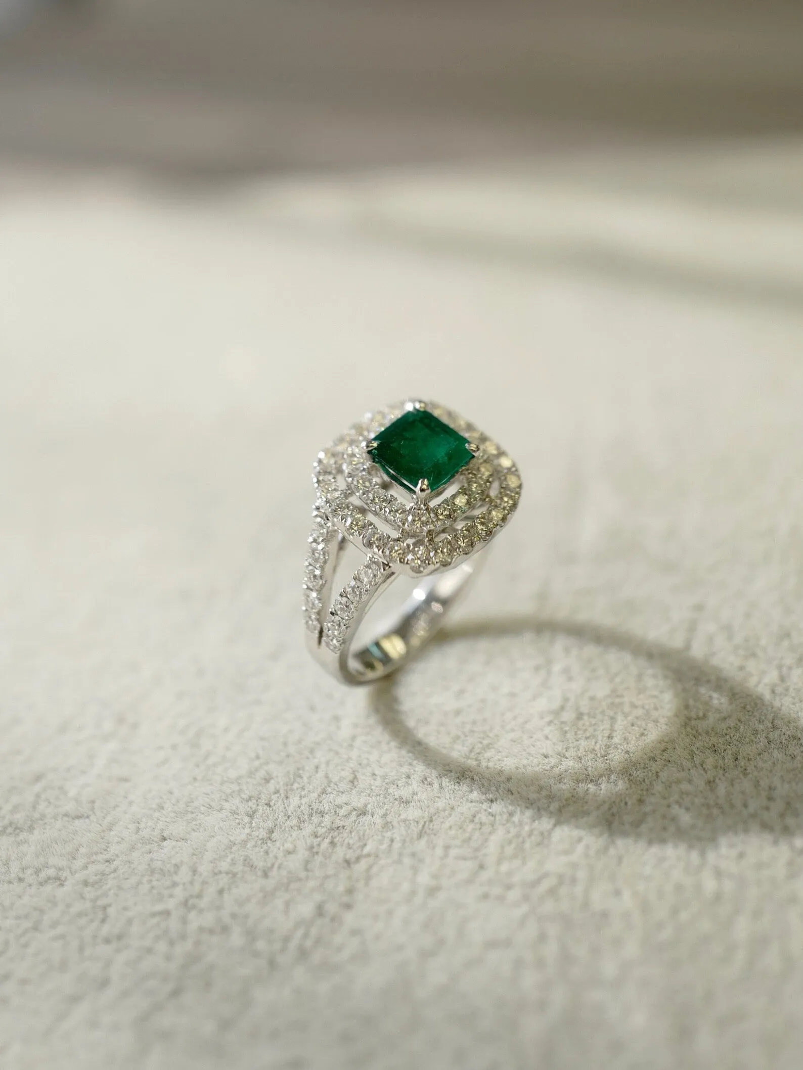 Emerald and Diamond Double Halo Ring in White Gold