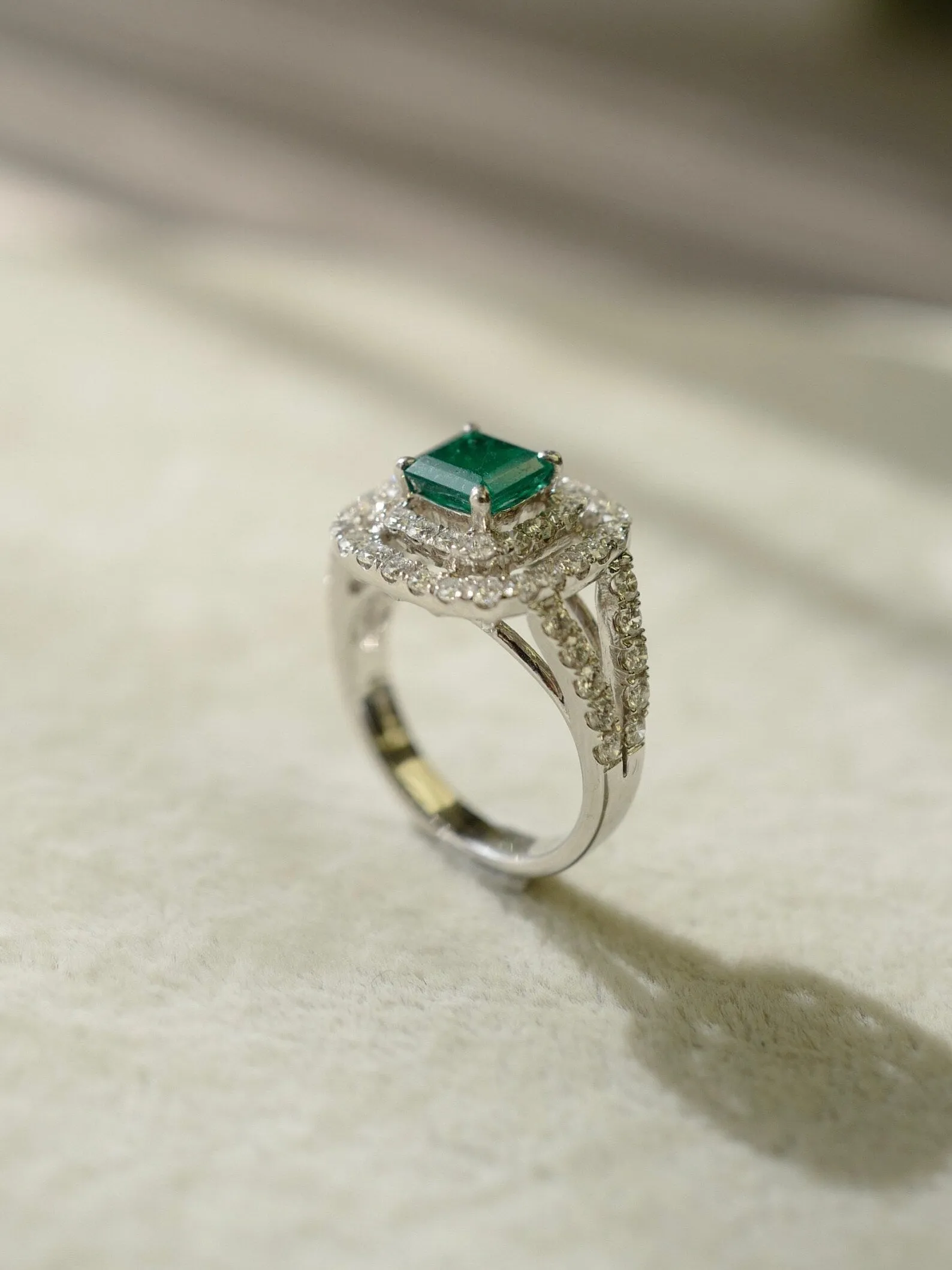 Emerald and Diamond Double Halo Ring in White Gold