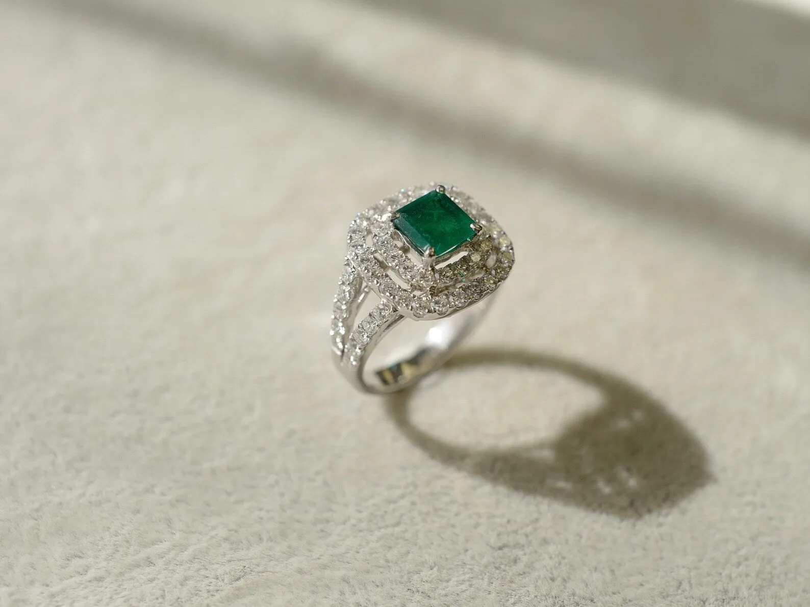 Emerald and Diamond Double Halo Ring in White Gold