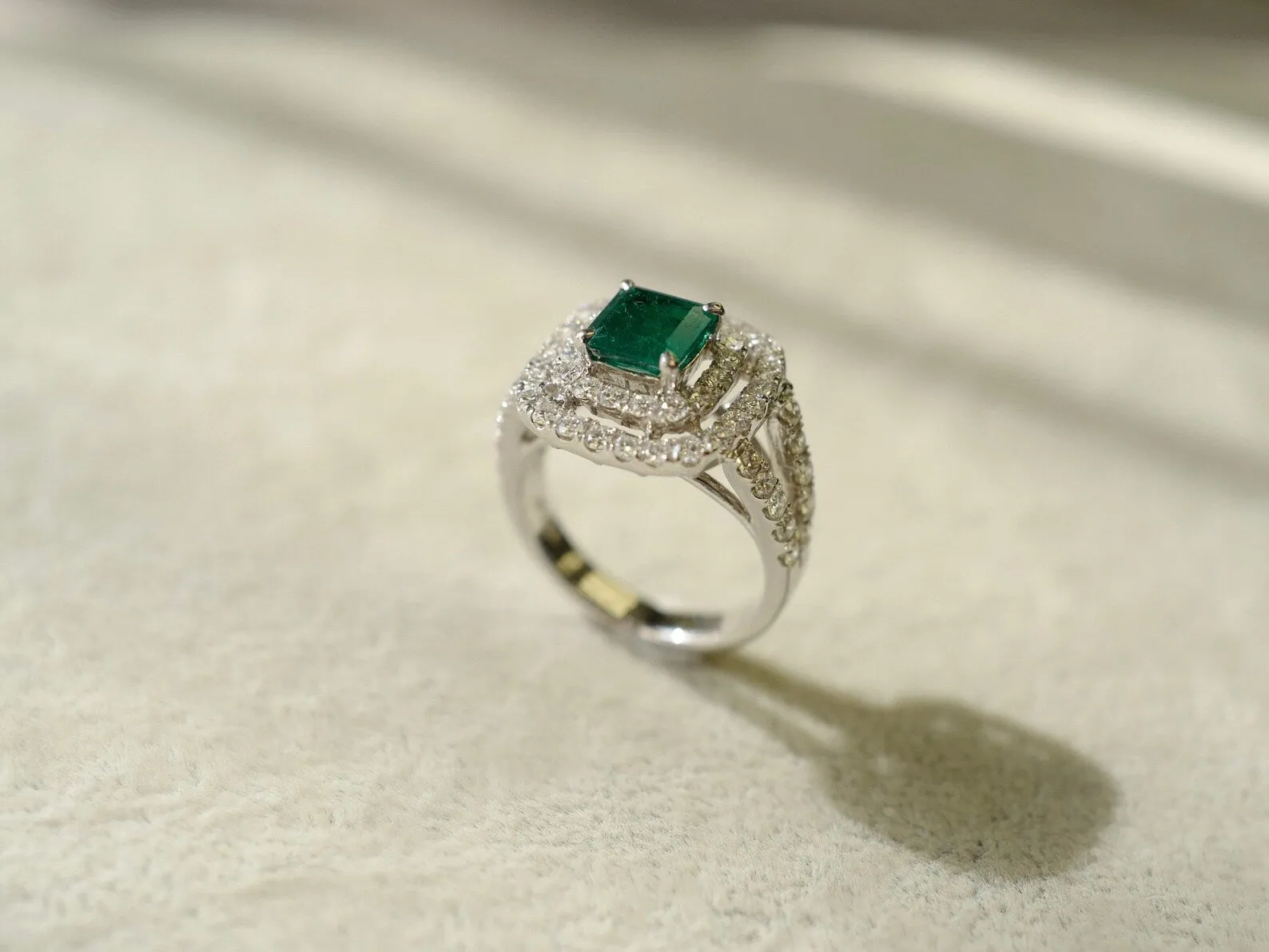 Emerald and Diamond Double Halo Ring in White Gold