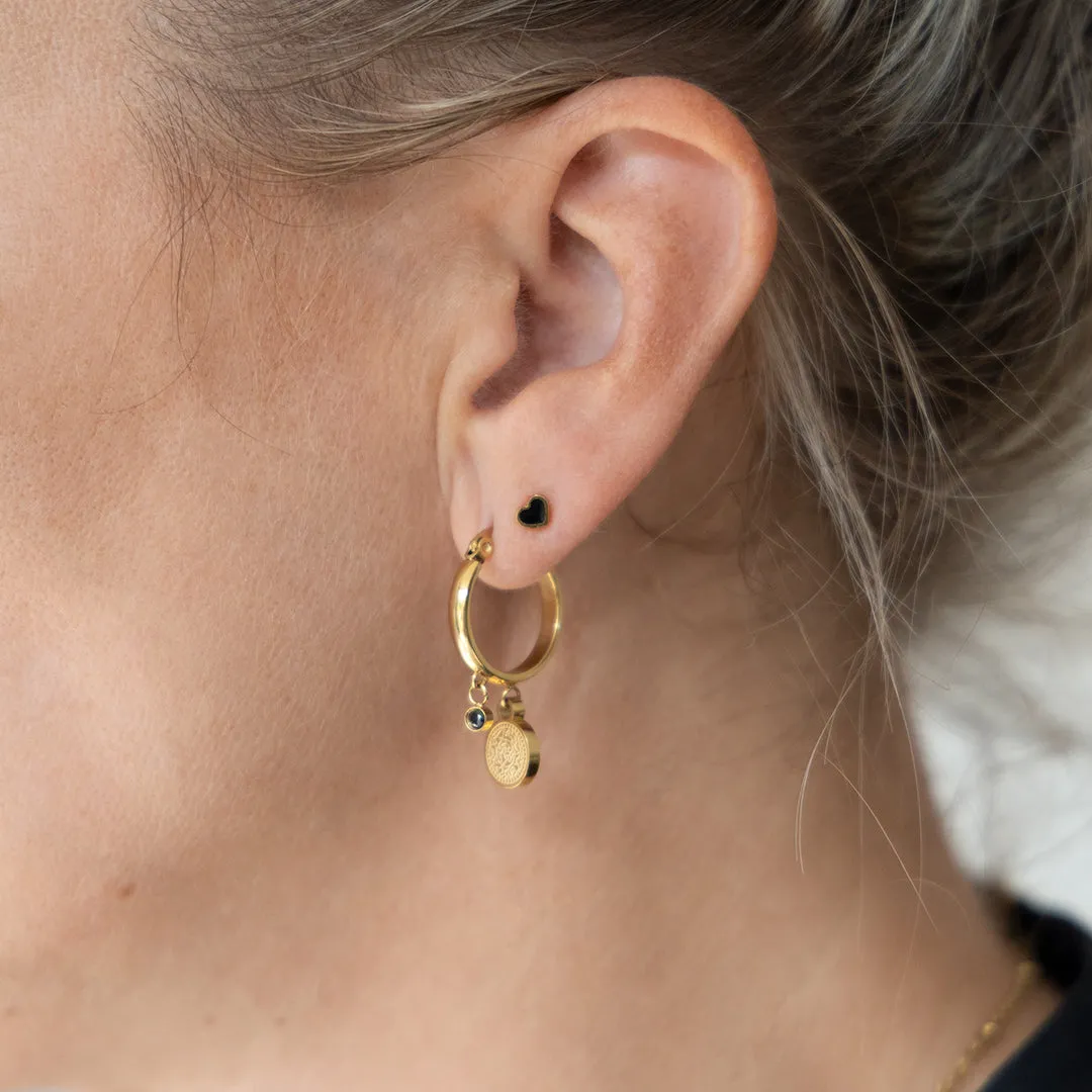 Gold coloured hoop earrings with a coin charm