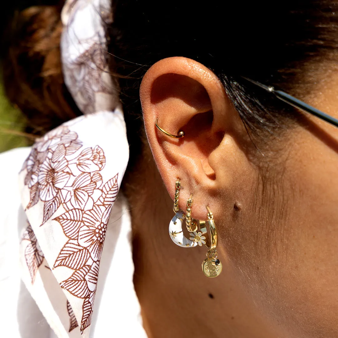 Gold coloured hoop earrings with a coin charm